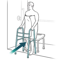 Person holding onto walker, facing away from chair that's in shower, with arrow pointing at leg touching chair.
